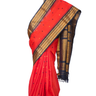 Handloom Gadwal silk cotton saree with all-over zari buttis and rich brocade pallu.
