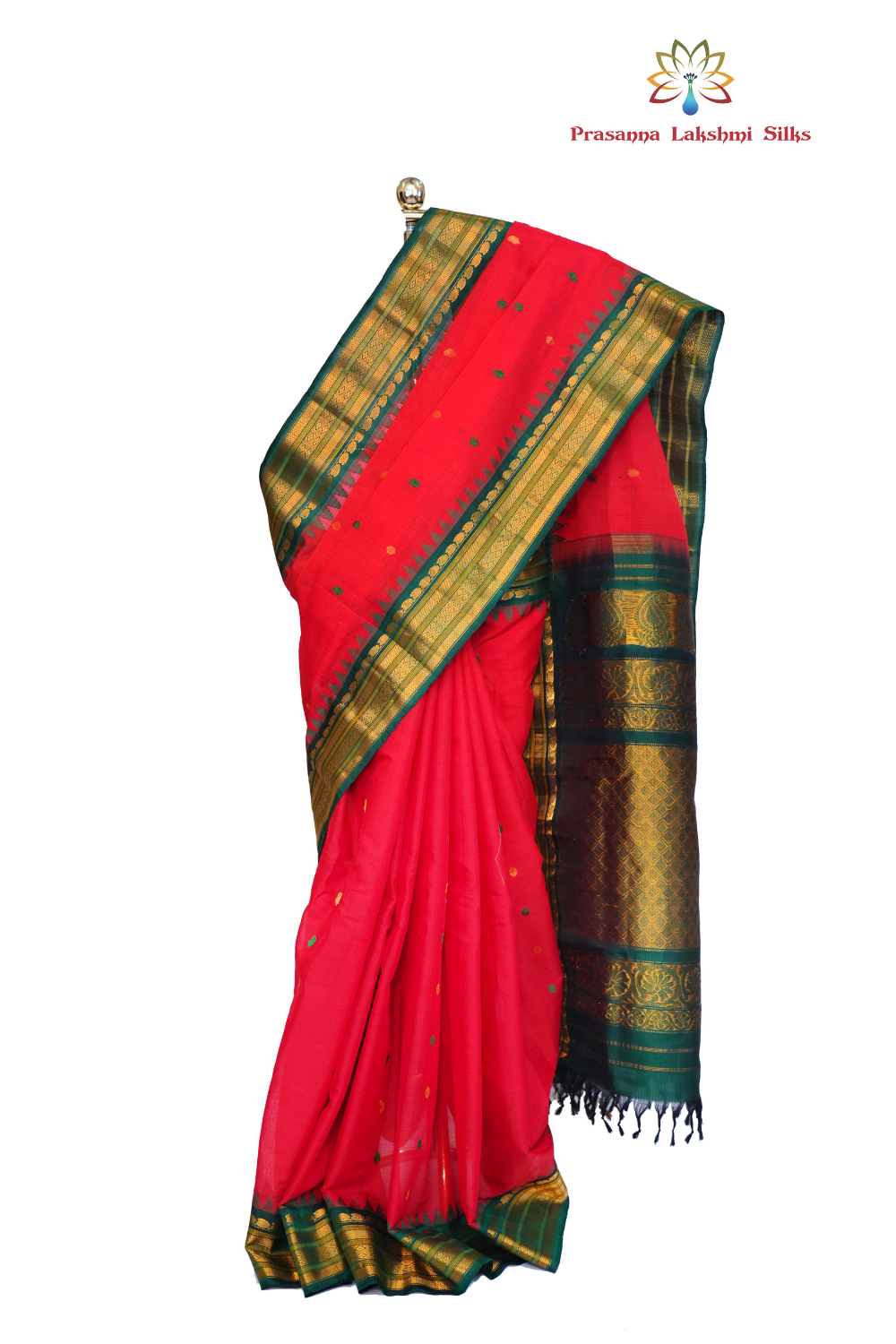 Handloom Gadwal silk cotton saree with all-over zari buttis and rich brocade pallu.
