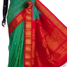 Handloom Gadwal silk cotton saree with all-over zari buttis and rich brocade pallu.
