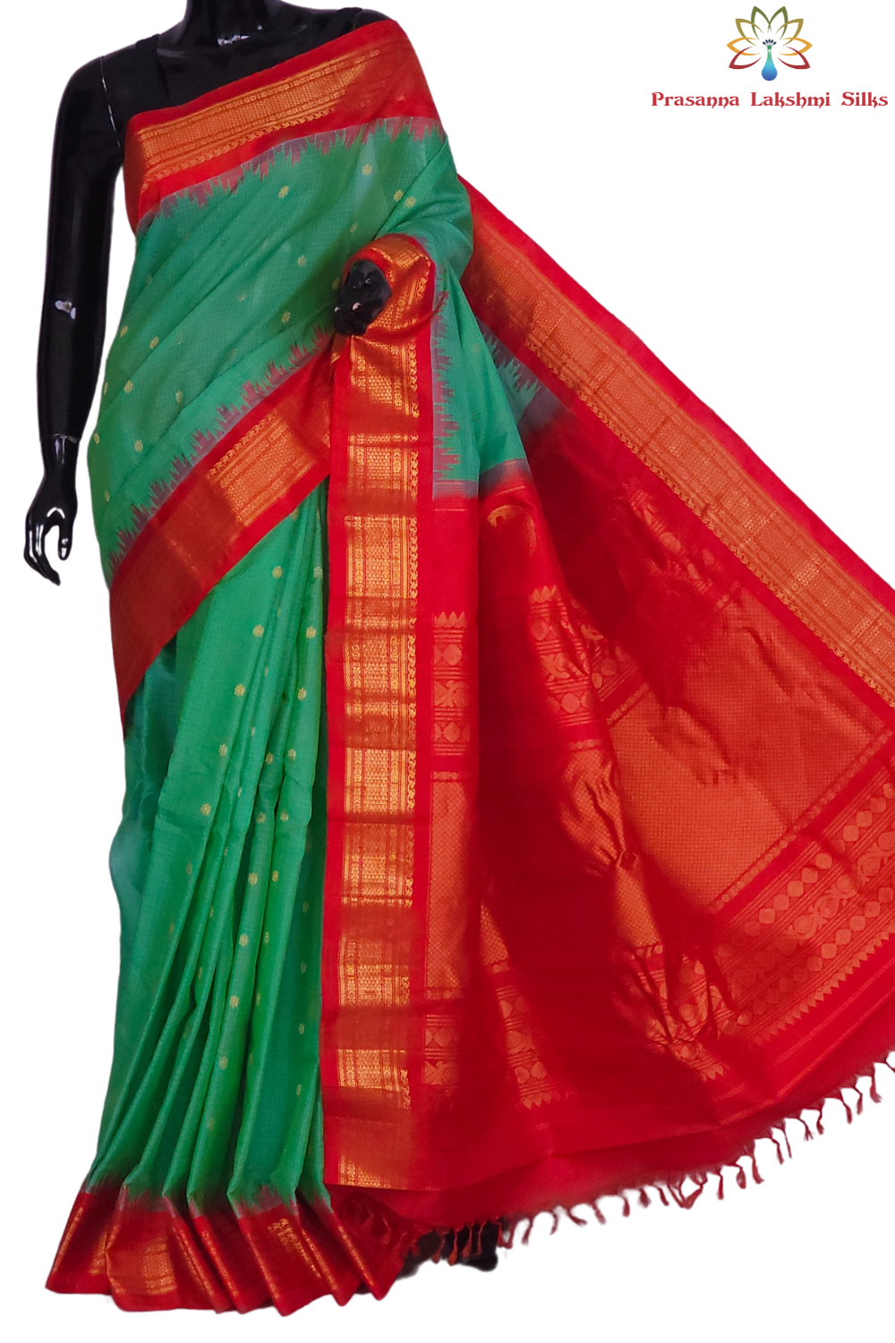 Handloom Gadwal silk cotton saree with all-over zari buttis and rich brocade pallu.
