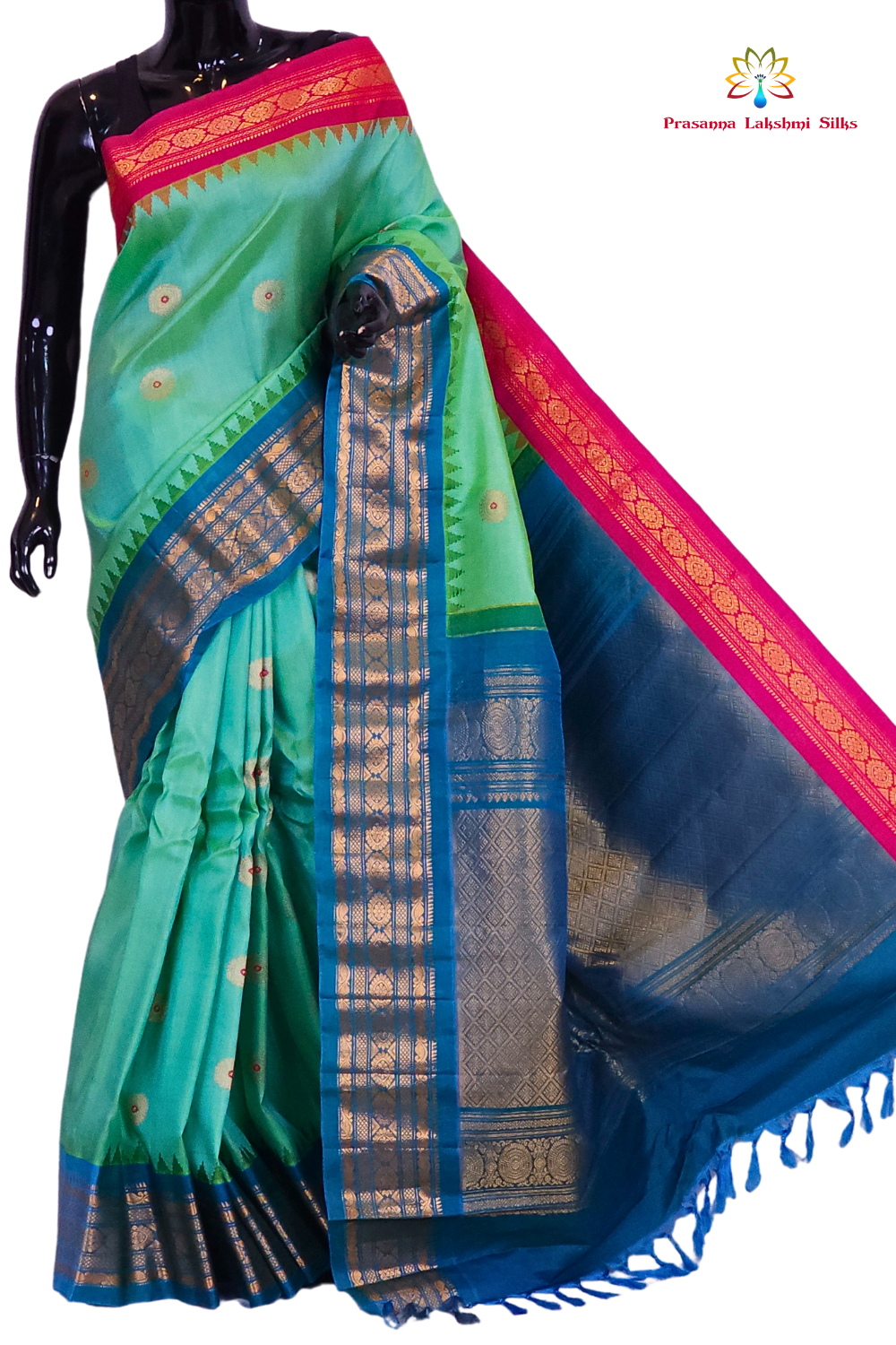 Sea green Gadwal silk saree featuring intricate zari motifs and a unique teal blue and pink Ganga Jamuna rich zari border, draped elegantly to showcase the full color contrast.