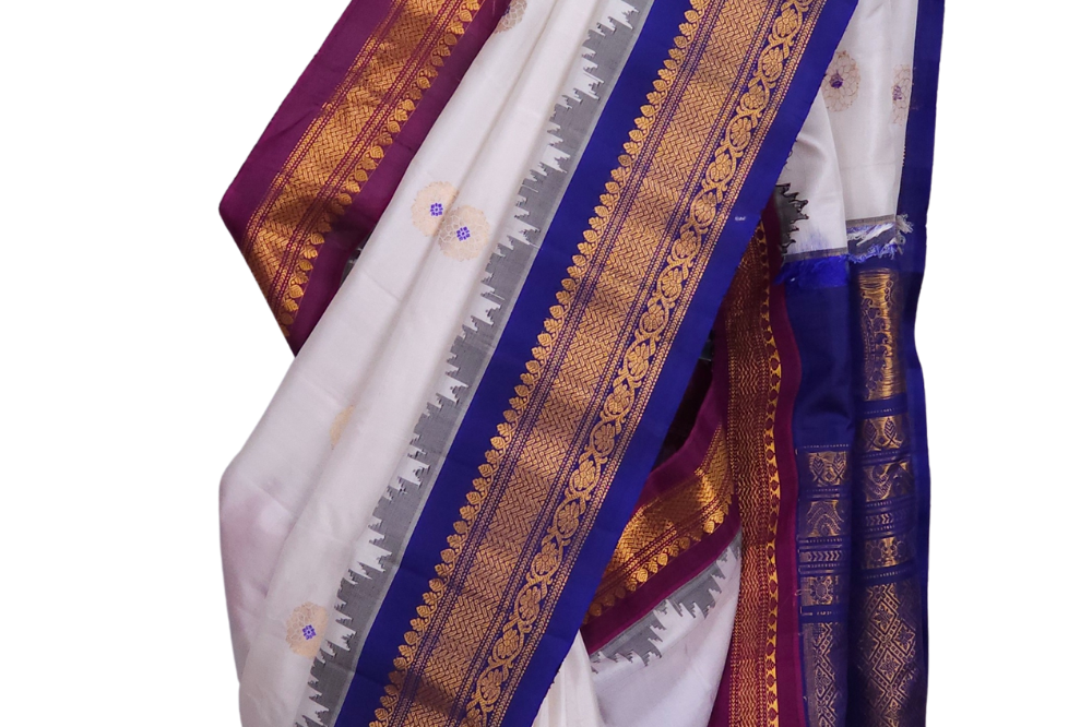Silk Mark certified Gadwal silk saree in half white with dual Blue Magenta border and rich zari motifs

