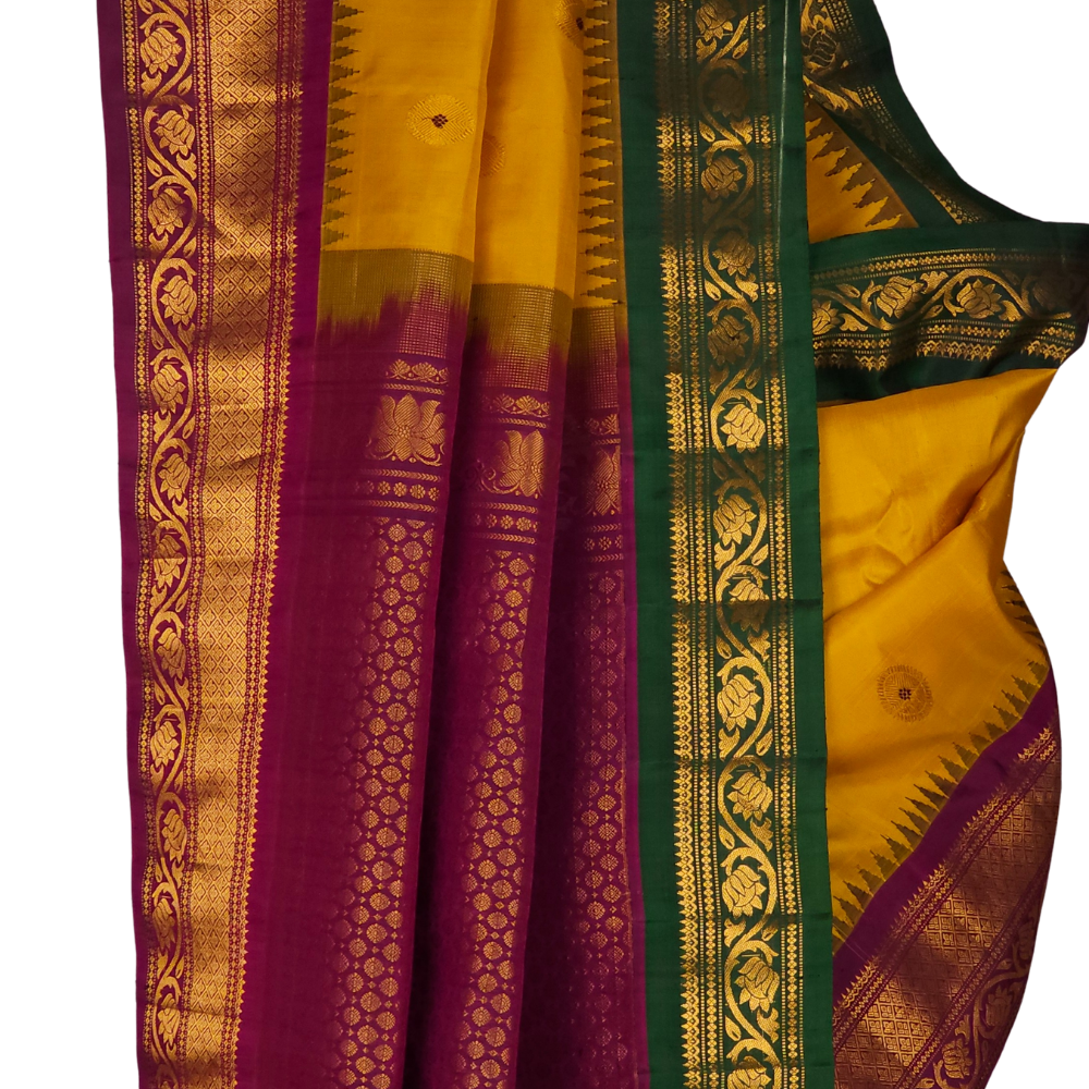 Silk Mark certified Gold Yellow Gadwal silk saree with dual Purple Green border and intricate zari motifs

