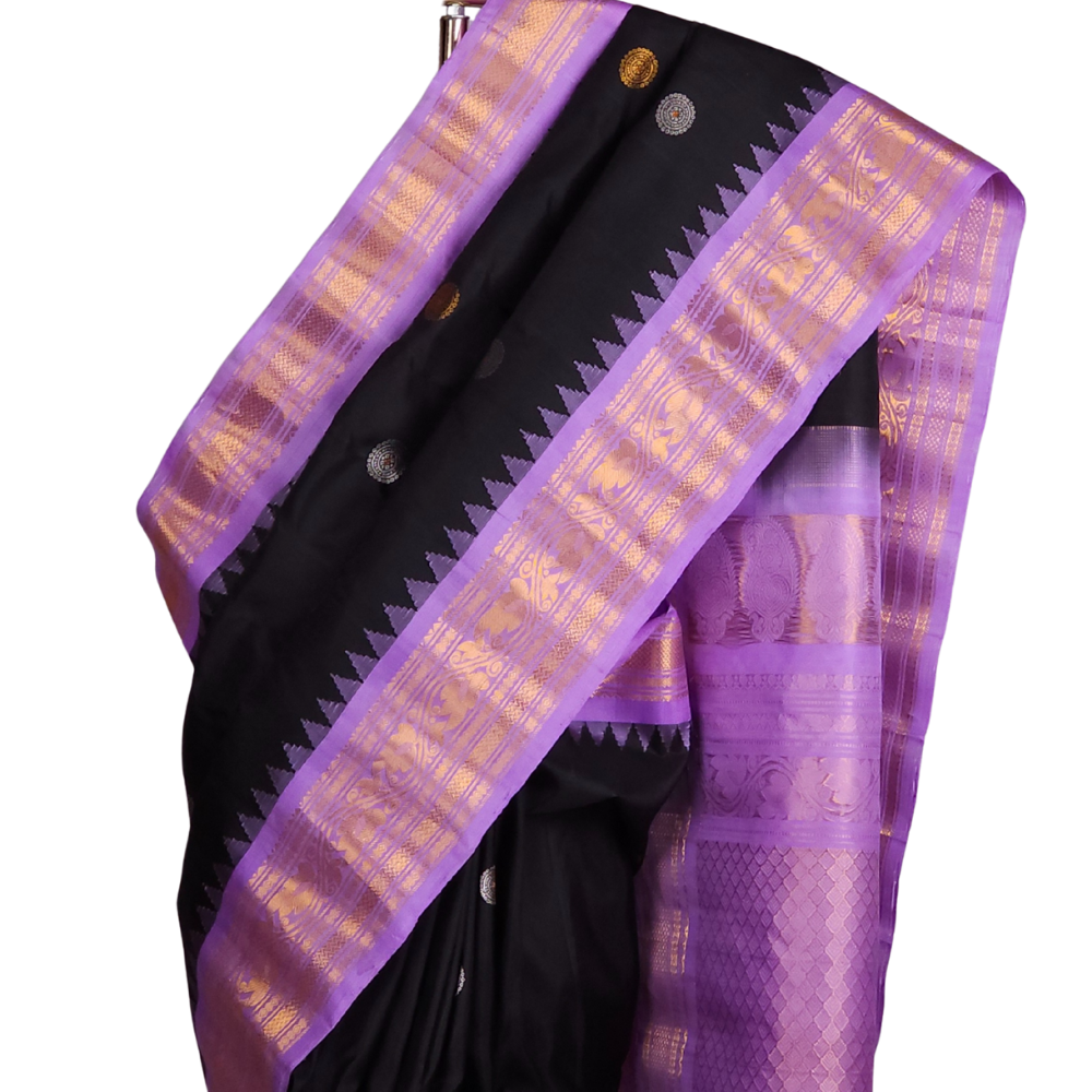 Silk Mark certified black Gadwal silk saree with lavender contrast border and intricate zari motifs

