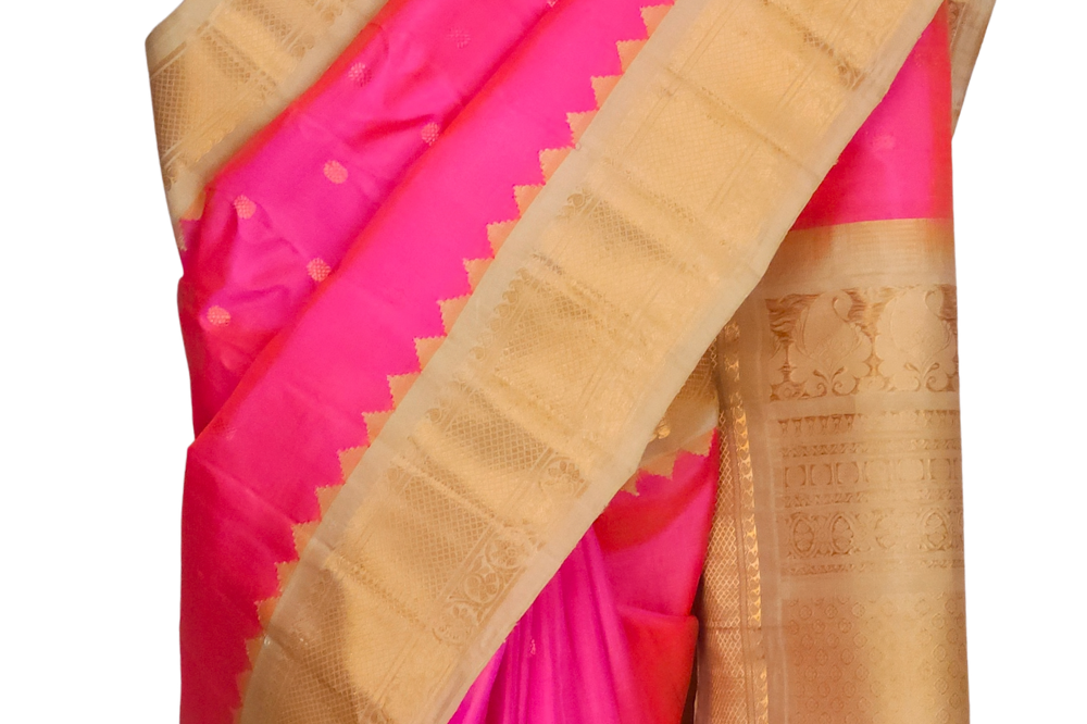 Silk Mark certified hot pink Gadwal silk saree with cream blouse and intricate zari motifs
