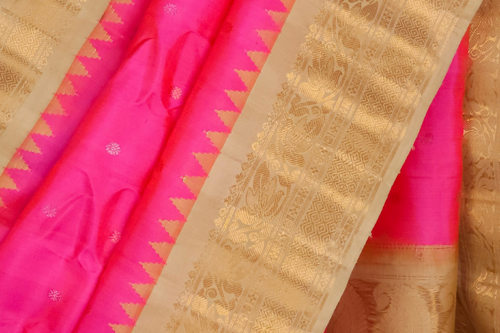 Silk Mark certified lotus pink Gadwal silk saree with beige blouse and intricate zari motifs
