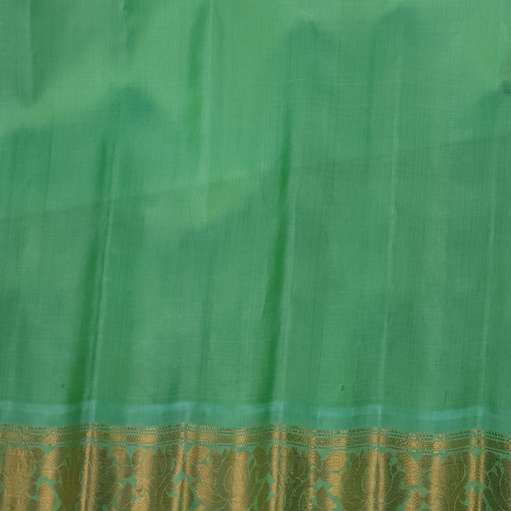 Silk Mark certified navy blue Gadwal silk saree with contrast Sea Green border and intricate zari motifs

