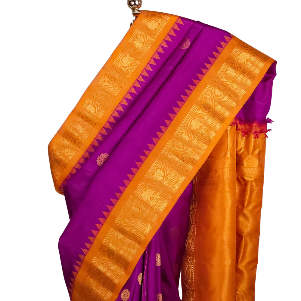 Silk Mark certified purple Gadwal silk saree with contrast Light Orange border and intricate zari motifs

