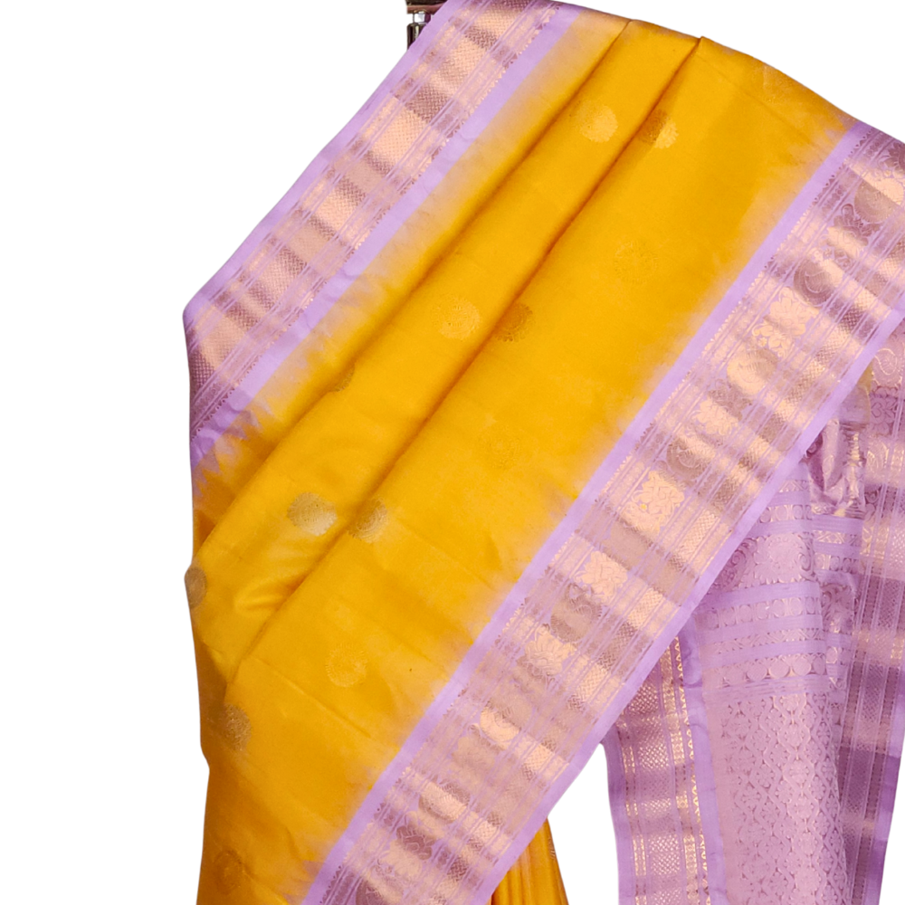 Silk Mark certified yellow Gadwal silk saree with lavender contrast border and intricate zari motifs

