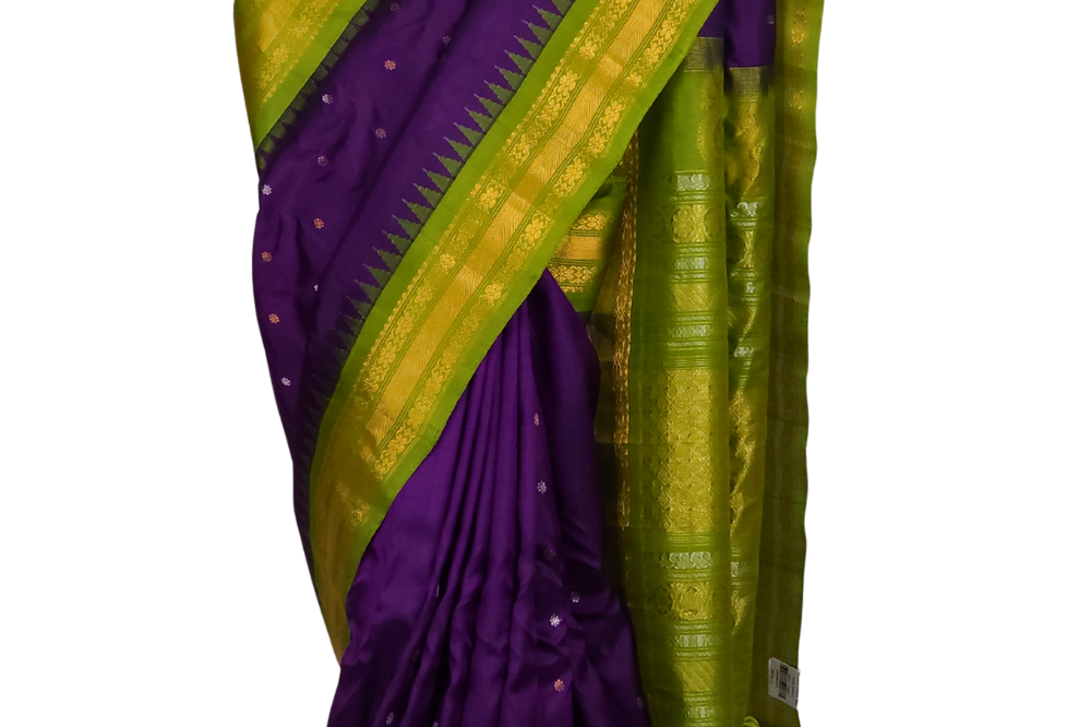 Violet Gadwal silk saree featuring intricate zari motifs and a striking olive green rich zari-woven border, displayed elegantly on a mannequin.