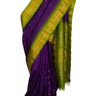 Violet Gadwal silk saree featuring intricate zari motifs and a striking olive green rich zari-woven border, displayed elegantly on a mannequin.