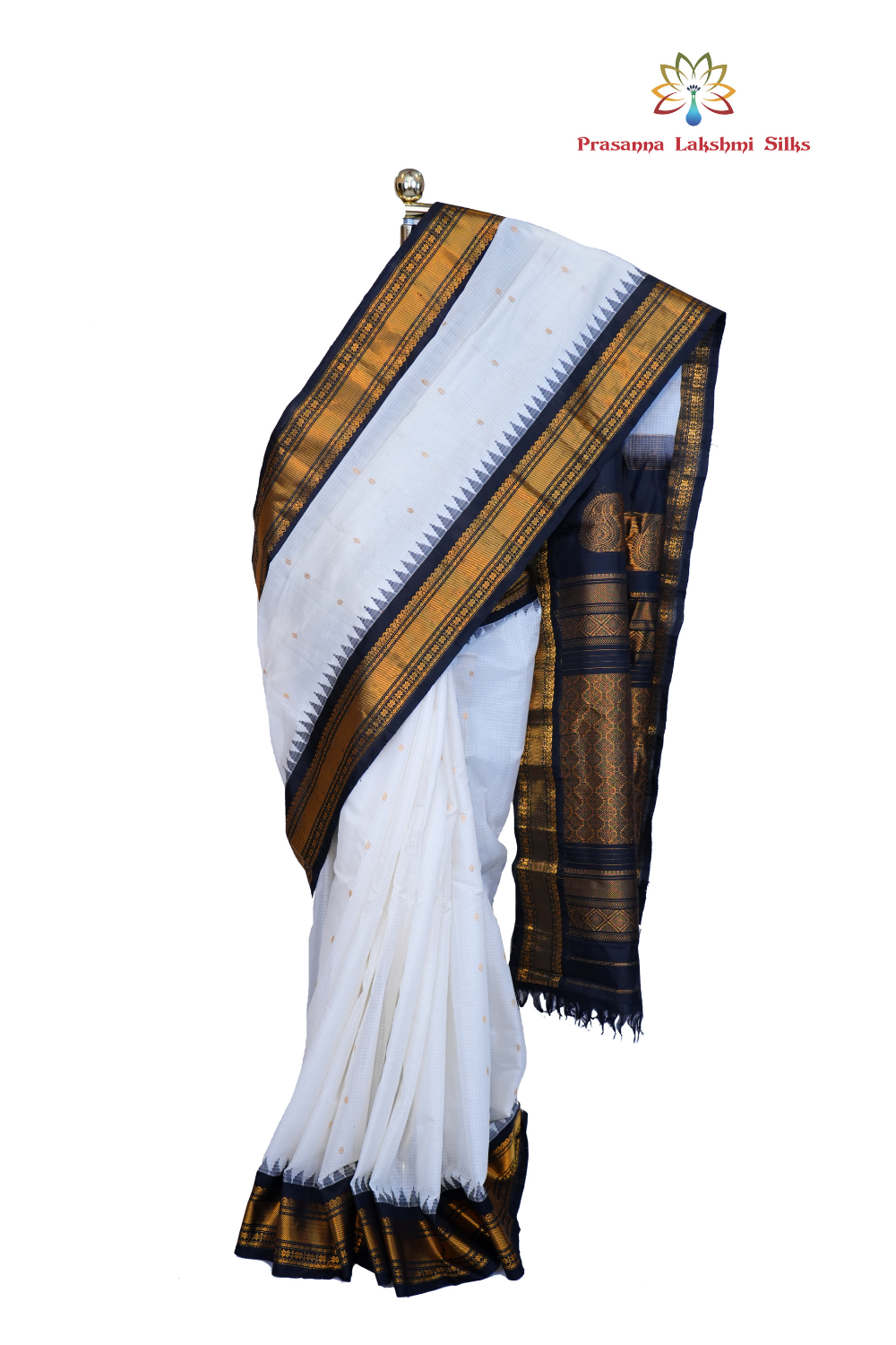 Handloom Gadwal silk cotton saree with all-over zari buttis and rich brocade pallu.
