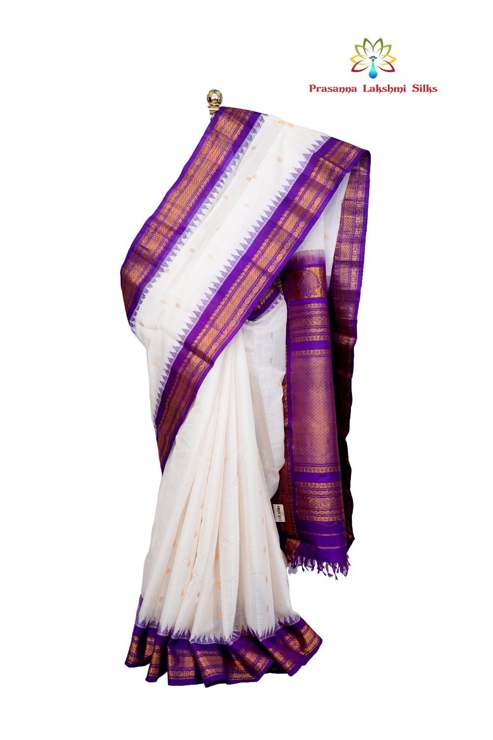 Handloom Gadwal silk cotton saree with all-over zari buttis and rich brocade pallu.
