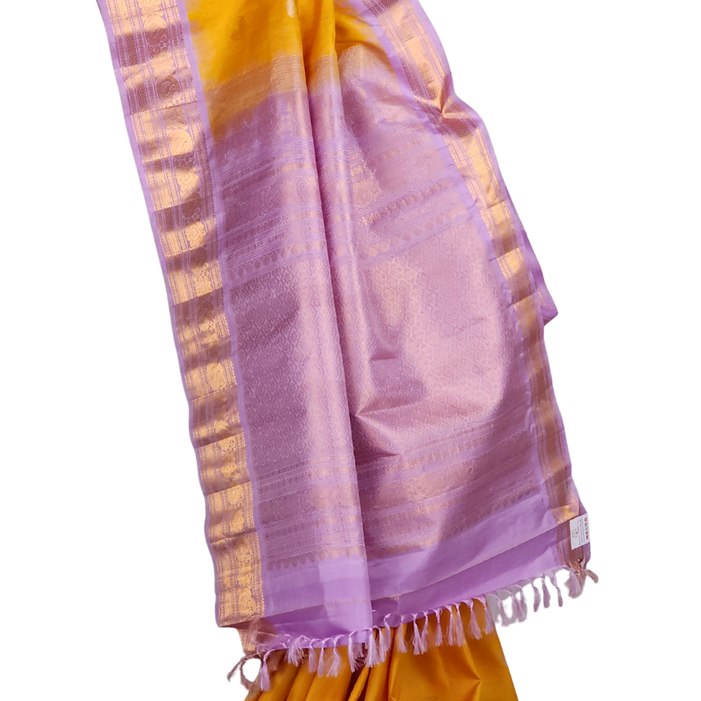 Yellow Handloom Gadwal Pure Silk Saree with lavender zari woven border and rich brocade pallu

