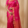 Pure handloom Gadwal silk saree with all-over zari motifs and intricate turning borders
