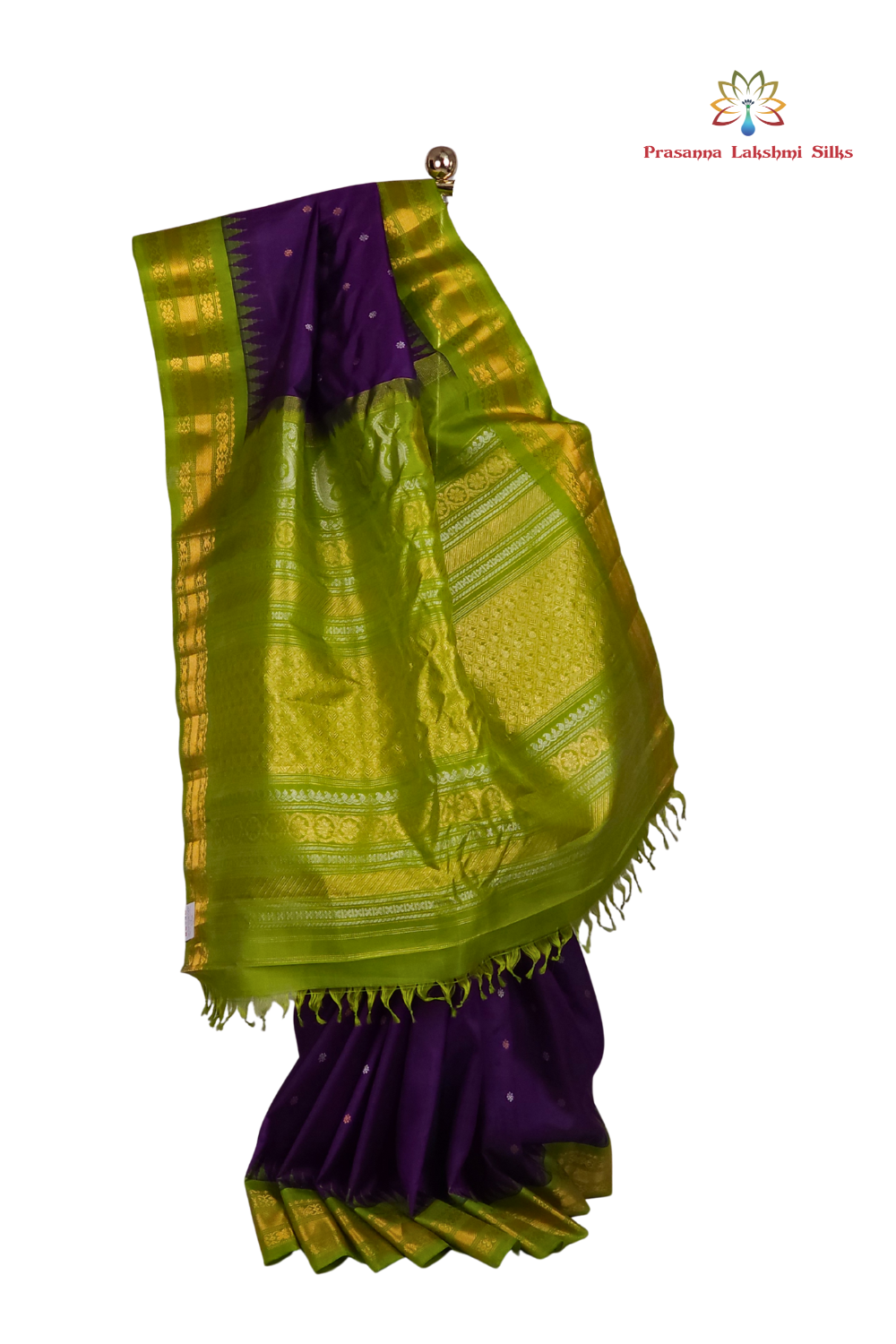 Close-up shot of the rich zari-woven brocade pallu on a handloom violet Gadwal pure silk saree, showcasing the detailed craftsmanship.
